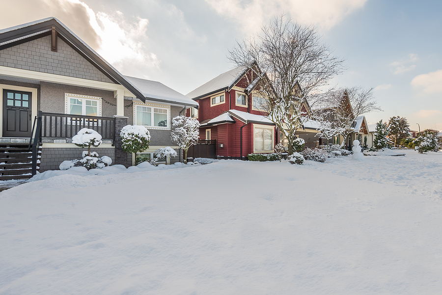 American neighborhood in the winter with snow on the ground.